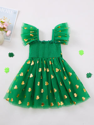 Green tulle baby dress with gold shamrock print, smocked bodice, and flutter sleeves.
