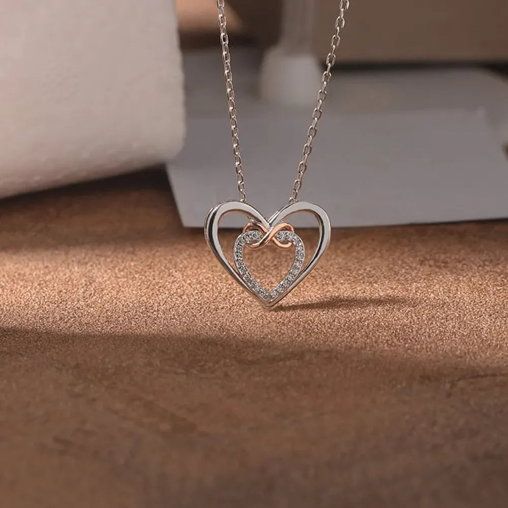 Silver double heart infinity pendant necklace with cubic zirconia accents