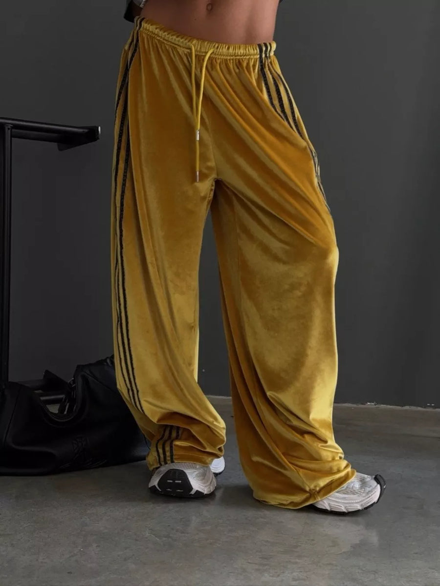 charcoal wide-leg pants featuring contrast stitching and striped