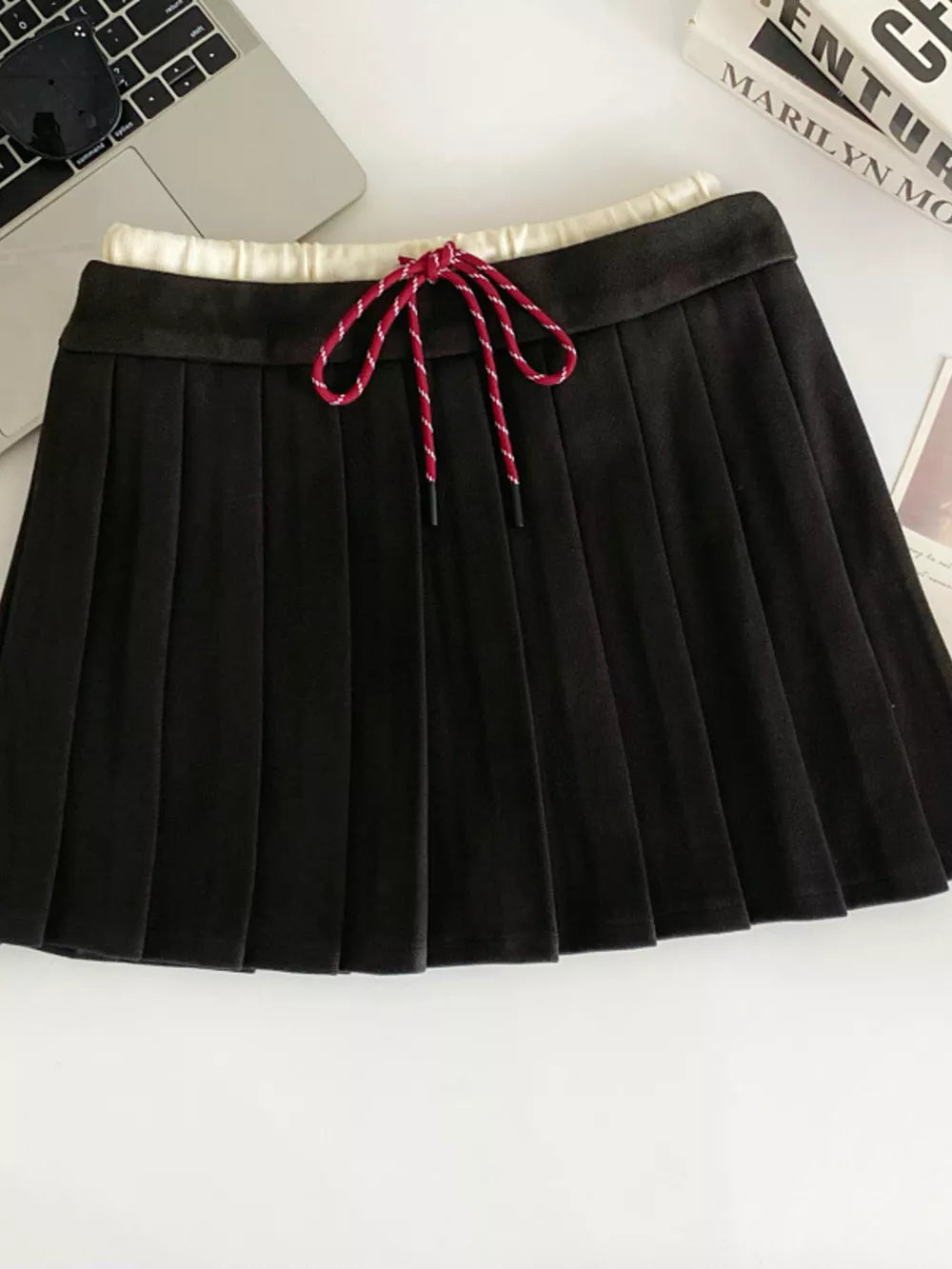Black pleated skirt with drawstring and elastic waistband