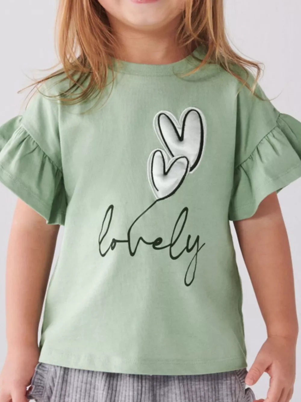 Charming heart graphic tee with ruffle sleeves