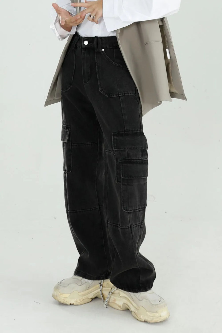 Black washed denim utility cargo pants with multiple pockets and a relaxed fit.