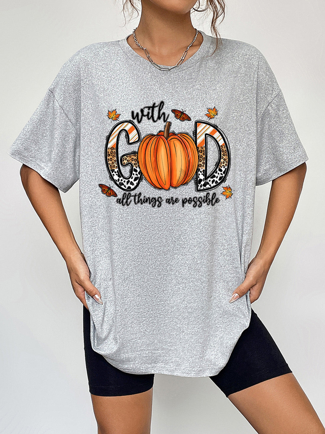 Grey graphic t-shirt with "with GOD all things are possible" text, pumpkin, and butterflies.