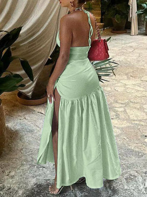 Light green halter neck ruched maxi dress with high slit and deep v-neck detail