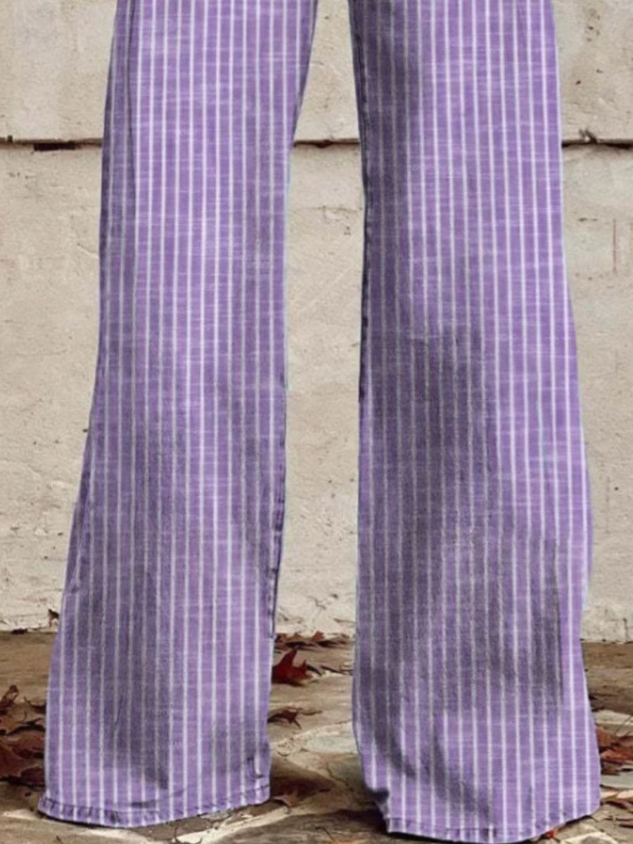Purple high-waisted wide-leg jeans with white vertical stripes and pockets.