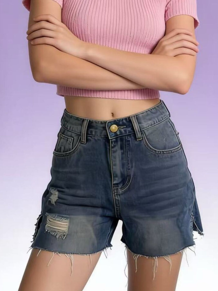 Blue denim shorts with frayed hem and distressed details