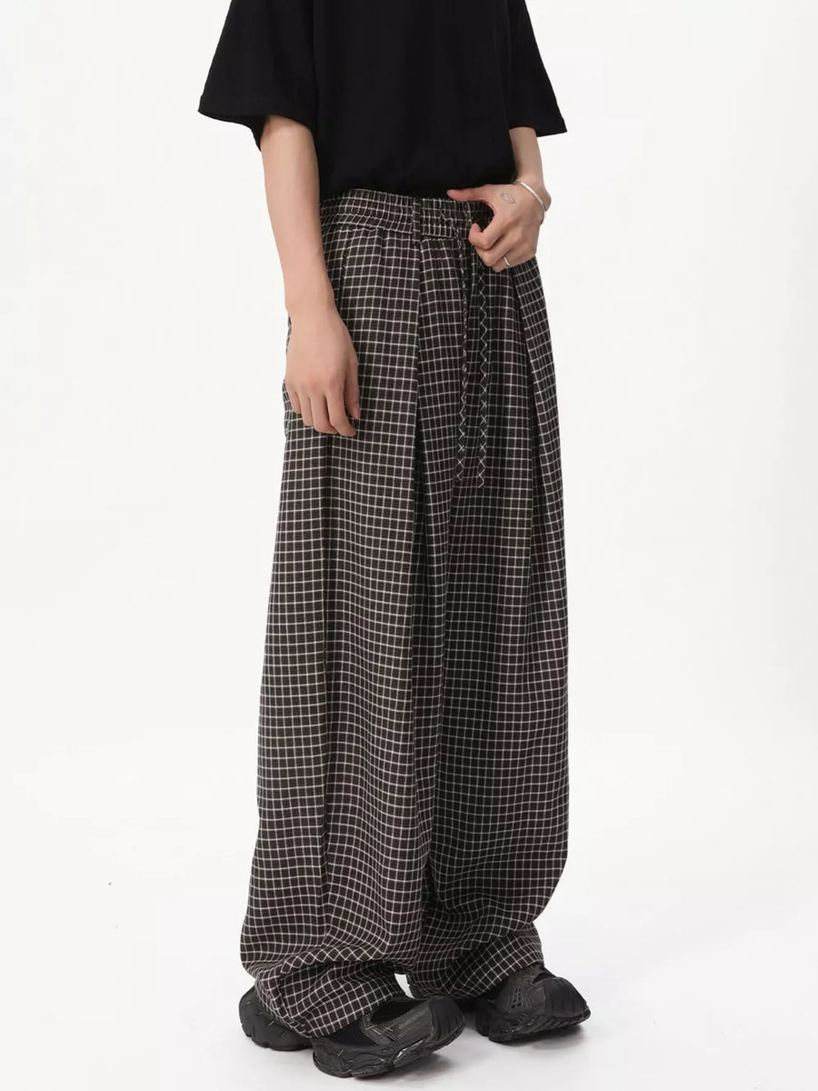 Plaid wide-leg relaxed fit pants in grey with adjustable drawstring waist.