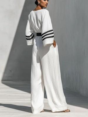 White jumpsuit featuring belted and striped