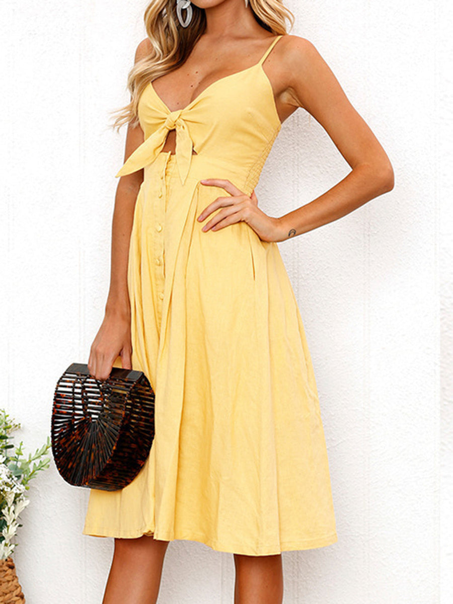 Yellow midi sundress with bow front, button detail, and spaghetti straps