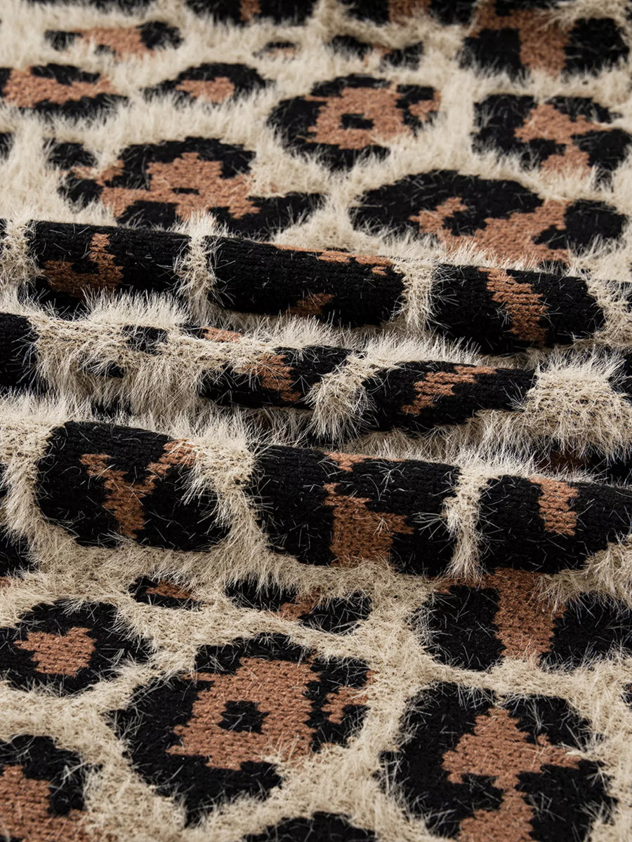 Leopard print fuzzy knit cardigan with textured details.