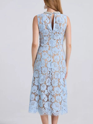 Blue lace dress with floral pattern and beaded neckline, midi length.