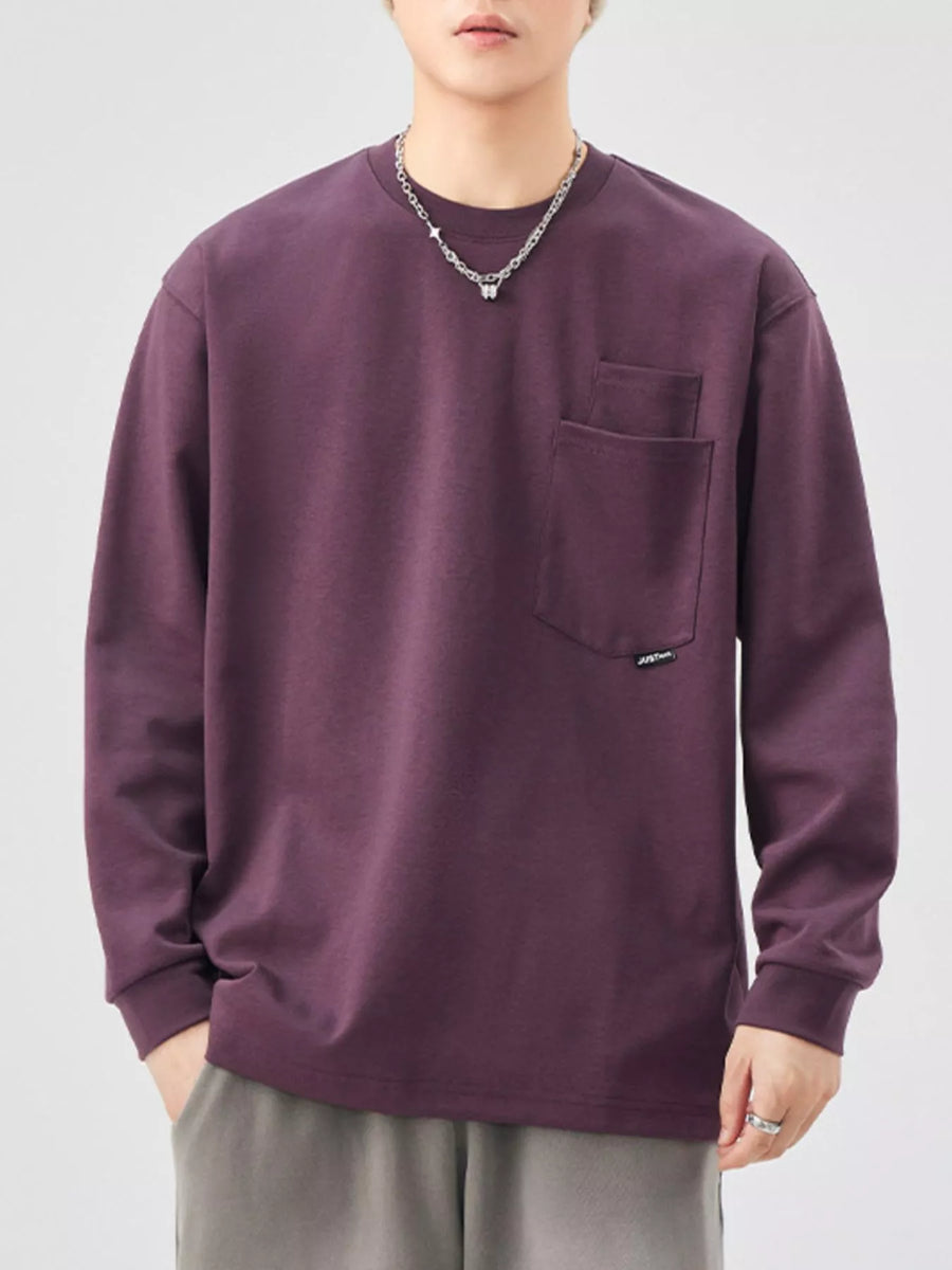 Casual oversized long-sleeve sweatshirt in Sauce Purple with a chest pocket and crew neck.