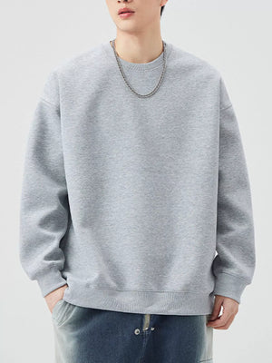 Oversized crew-neck sweatshirt in Melange Gray, with ribbed cuffs and hem.