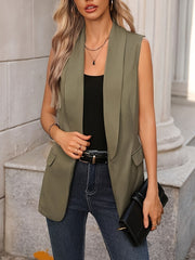 Moss shawl collar sleeveless vest coat with flap pockets, worn over a black tank top and jeans.