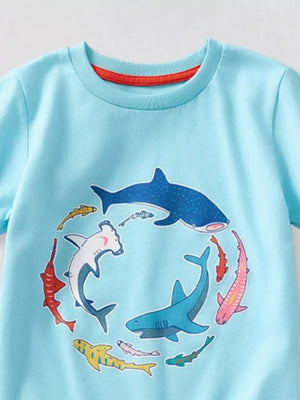 Light blue t-shirt with a circular graphic of various sharks and fish.