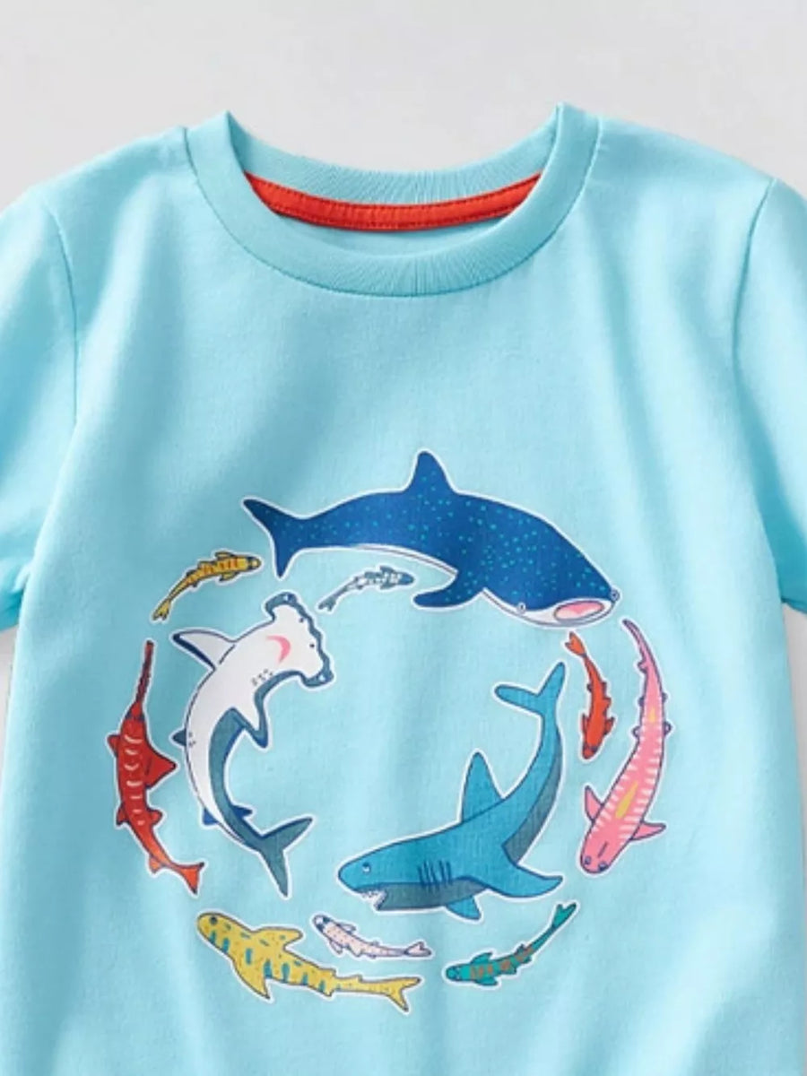 Light blue t-shirt with a circular graphic of various sharks and fish.
