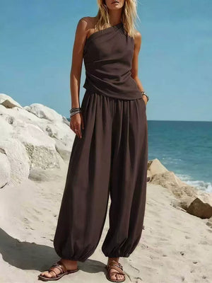 Brown one-shoulder top and wide-leg pants set with a relaxed fit and gathered waist.