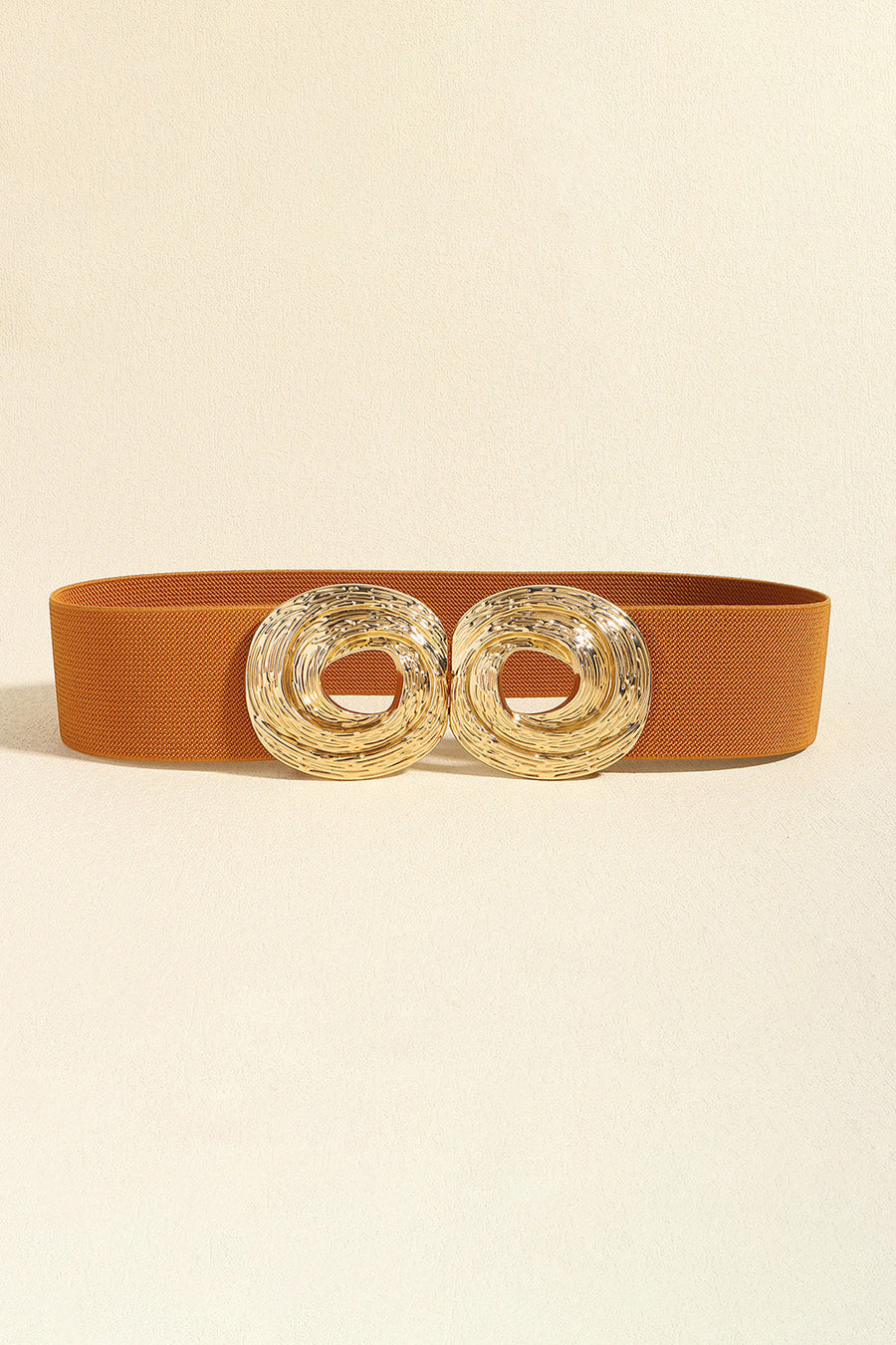 Caramel elastic belt with a double sculptural gold-tone alloy buckle.