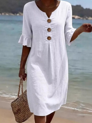 White linen dress with ruffled sleeves and button detail, V-neck, casual beach style