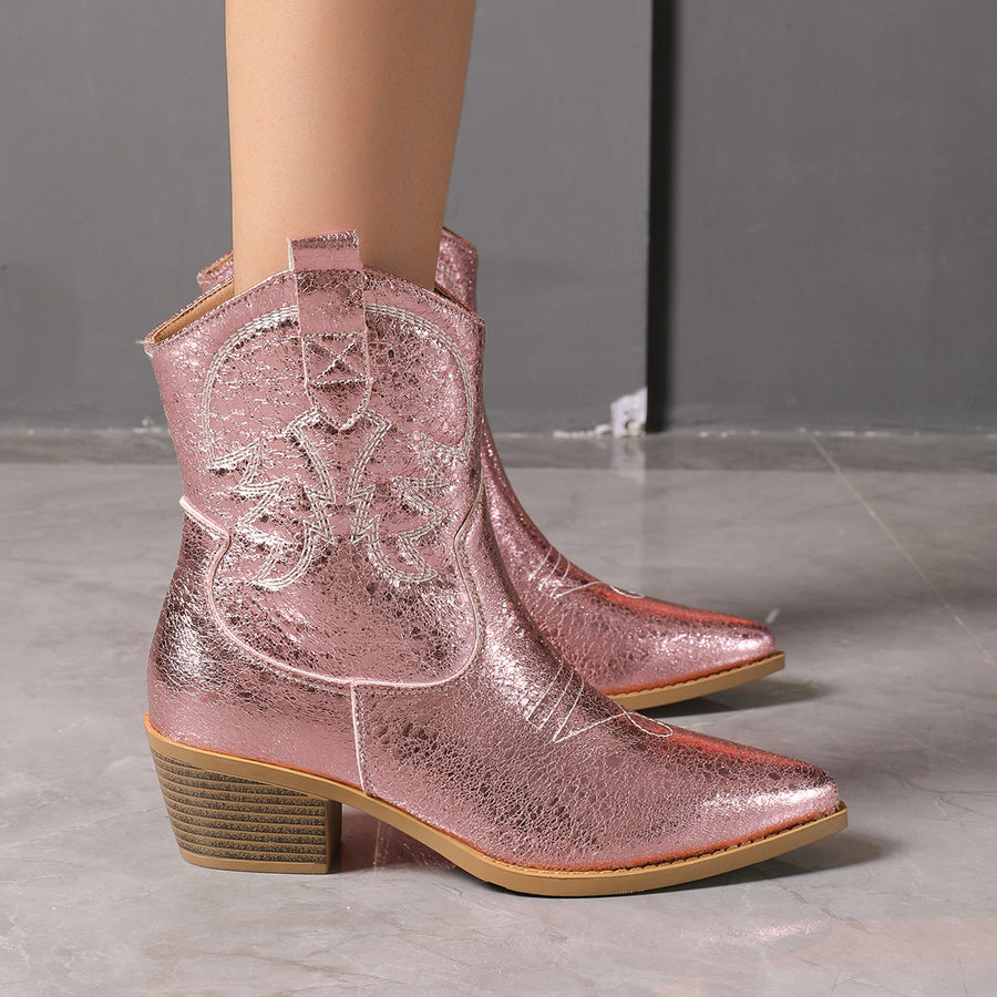 Pink boots featuring pointed toe and embroidered
