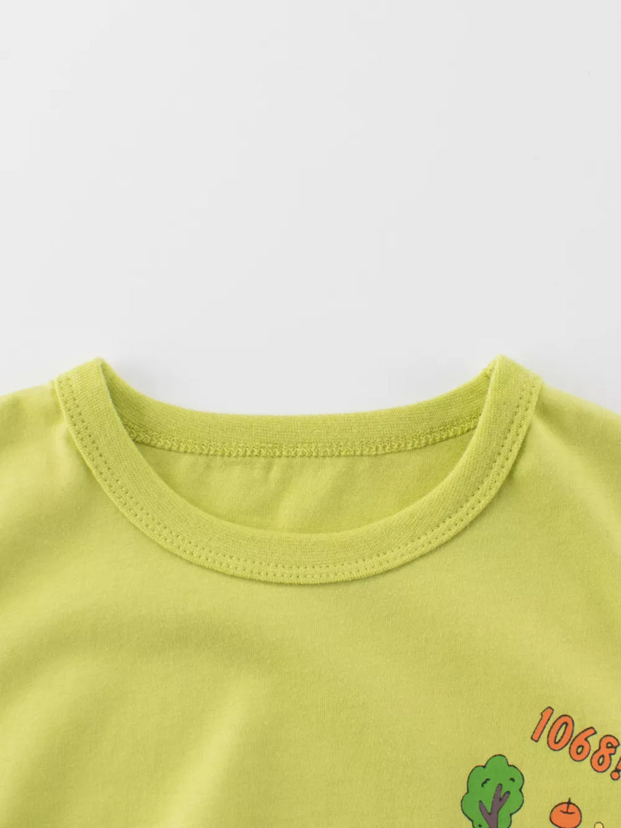 Lime green cotton t-shirt with crew neck and graphic print detail.