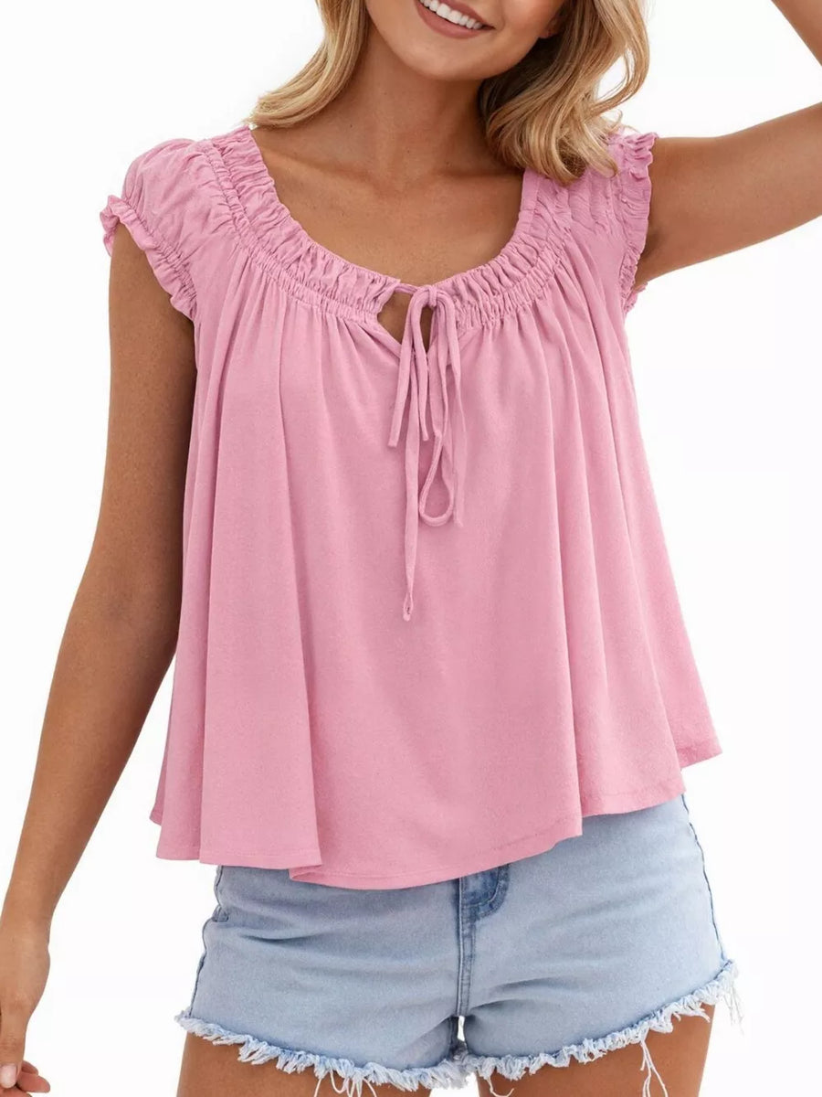 Pink tie-front gathered blouse with drawstring neckline and ruffled cap sleeves.