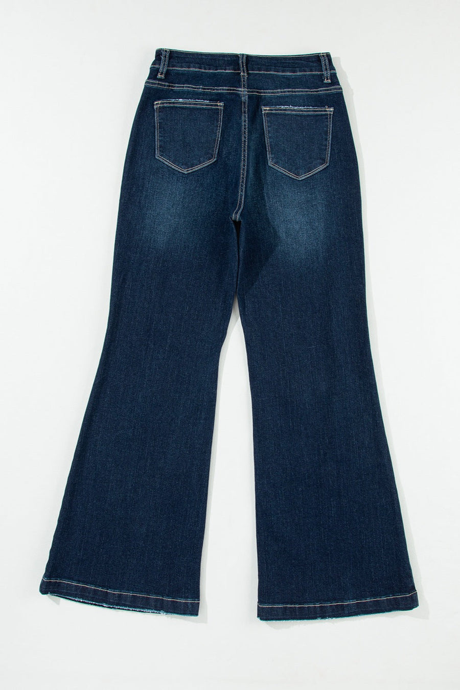 Dark wash denim widecut jeans with frayed hem and pocket details.