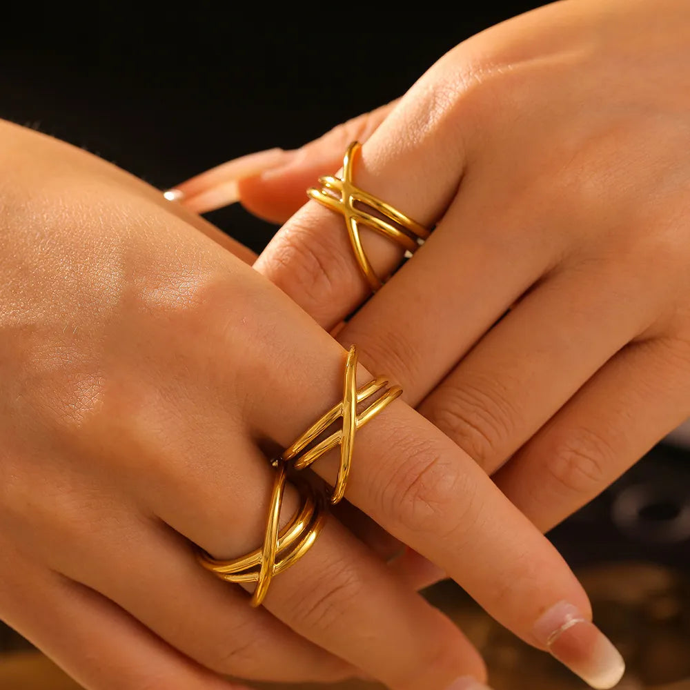 Gold intersecting band ring set with multiple thin bands crossing over each other.