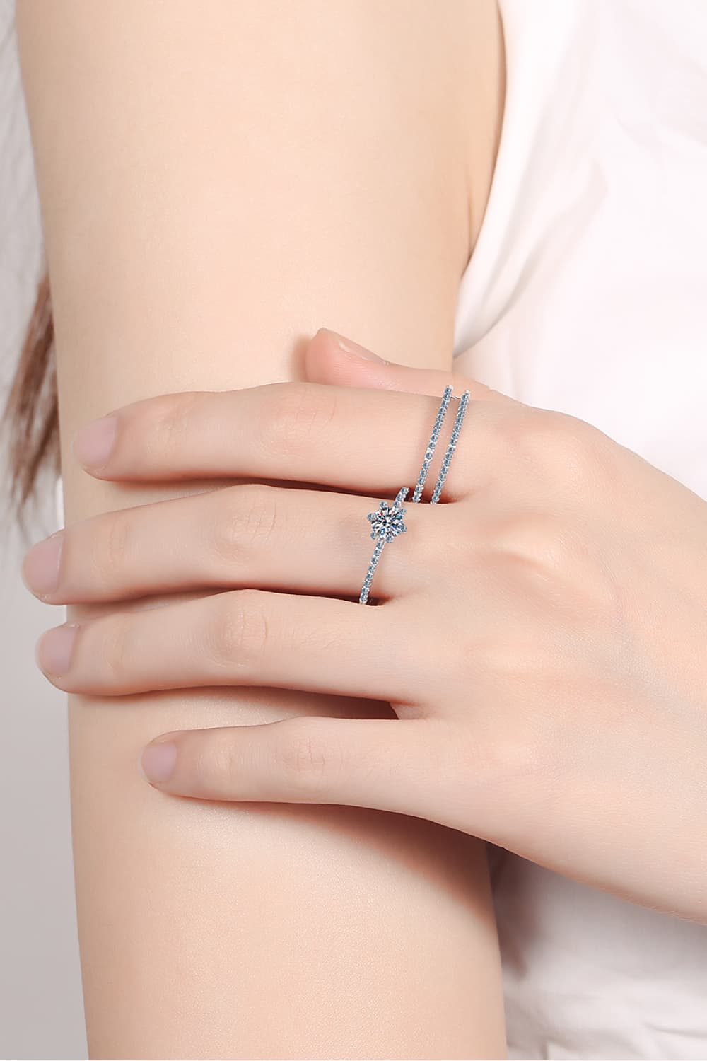 Silver celestial cluster ring trio with a flower-shaped center stone and delicate band.