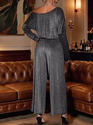Gray glitter one-shoulder jumpsuit with wide-leg pants and long sleeves.