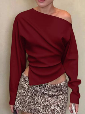 Burgundy draped asymmetrical off-shoulder t-shirt with long sleeves and a unique hemline.