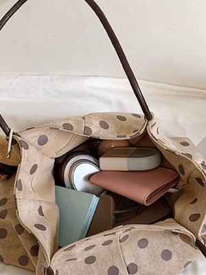 shoulder bag in tan with shoulder straps and medium