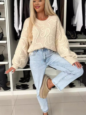 ivory pullover sweater with ribbed cuffs and long sleeve