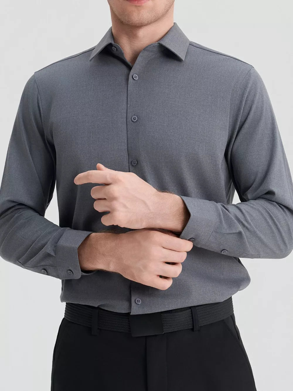 Men's dark gray slim fit long sleeve button-down shirt with buttoned cuffs.
