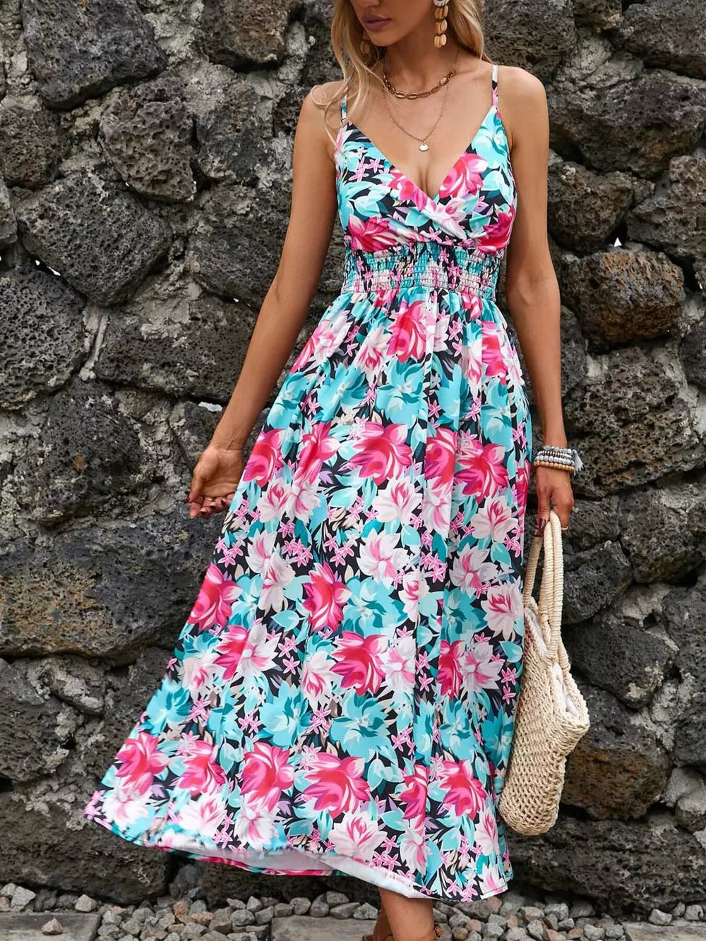 Maxi dress with floral print, V-neck, smocked waist, and spaghetti straps.
