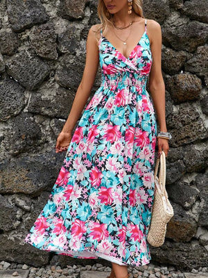 Maxi dress with floral print, V-neck, smocked waist, and spaghetti straps.