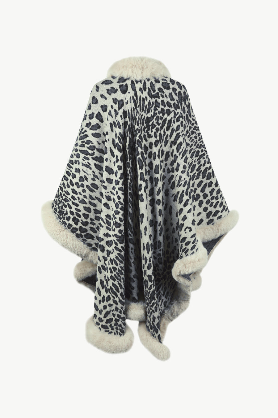 Leopard print cape with faux fur trim and collar in beige and black acrylic.