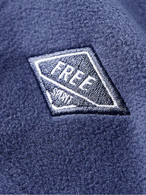 Men's blue fleece quarter zip sweatshirt with embroidered patch detail.