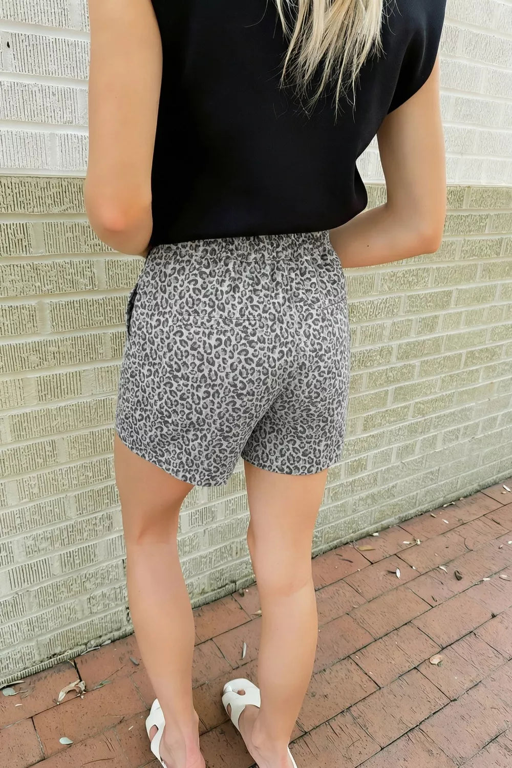 Denim shorts with leopard print in grey and black, elastic waist, women's casual style.