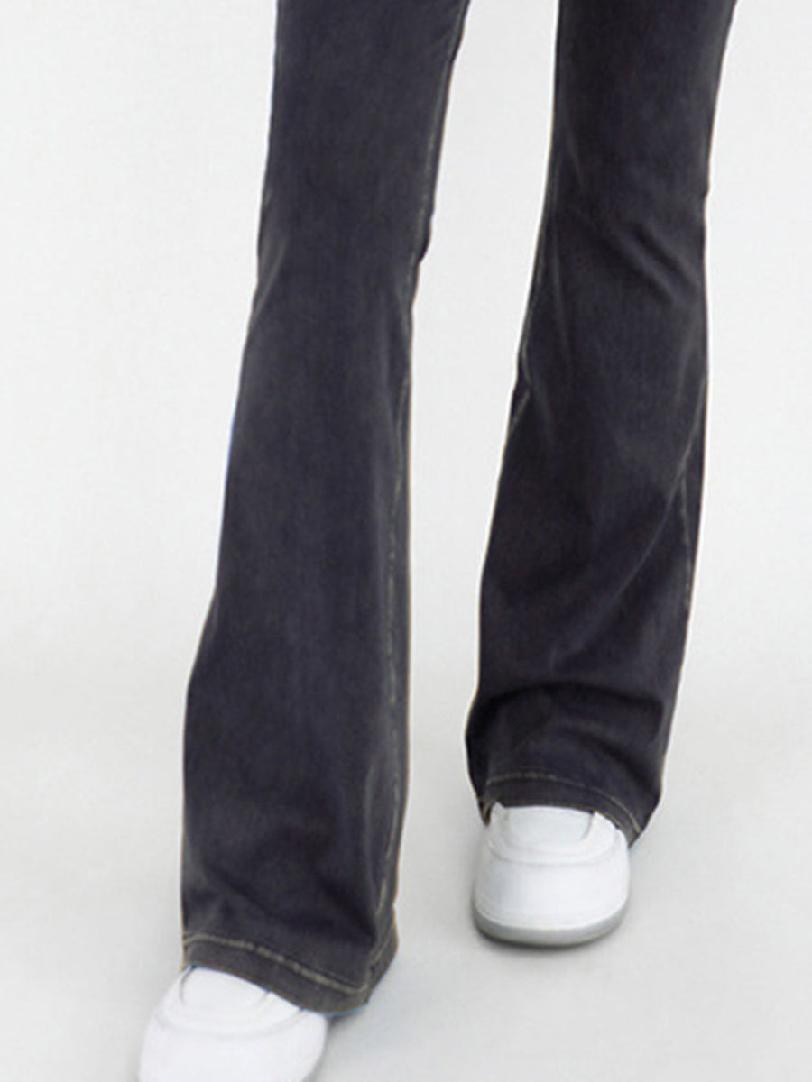 Charcoal crossover waist flare jeans with a bootcut leg and contrast stitching.