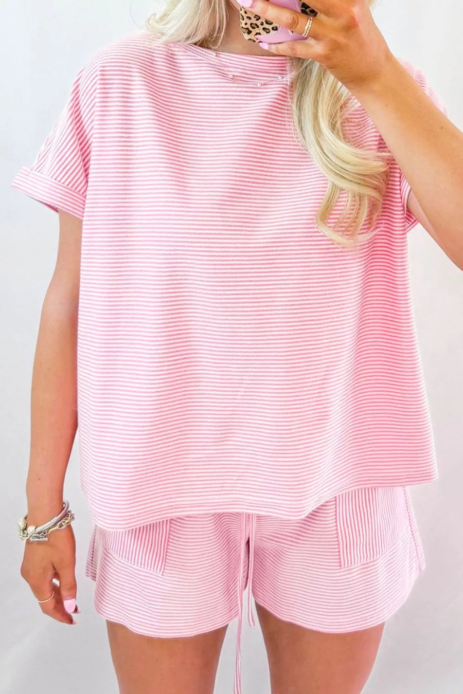 Casual striped oversized tee and shorts ensemble with drawstring shorts