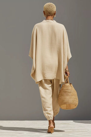 Beige relaxed fit two-piece set with wide sleeves and cuffed pants.