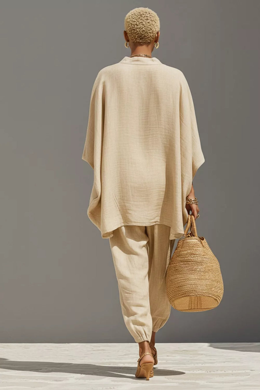 Beige relaxed fit two-piece set with wide sleeves and cuffed pants.