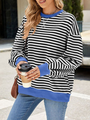 Striped crew neck sweatshirt with royal blue trim and cuffs.