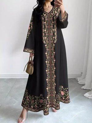 Black floral embroidered maxi dress with V-neck and long sleeves.