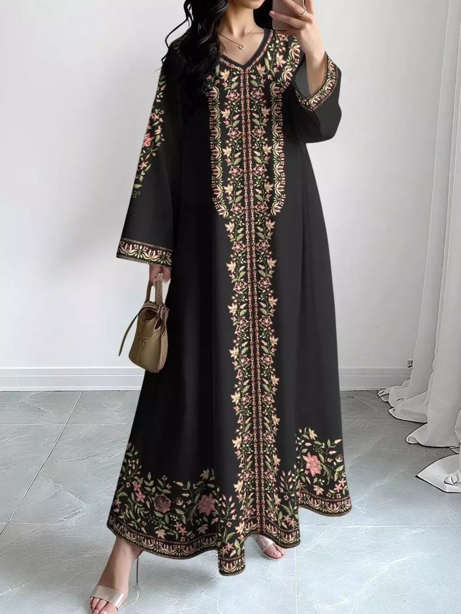 Black floral embroidered maxi dress with V-neck and long sleeves.