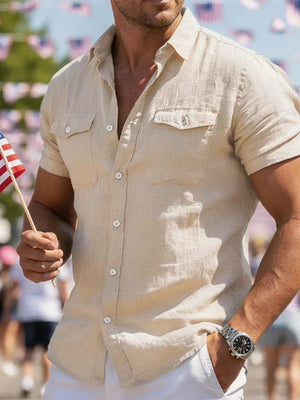 Khaki short sleeve button-up shirt with two chest pockets and a spread collar.