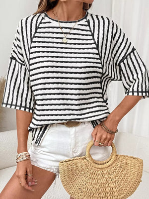 white t-shirt featuring seam detail and striped