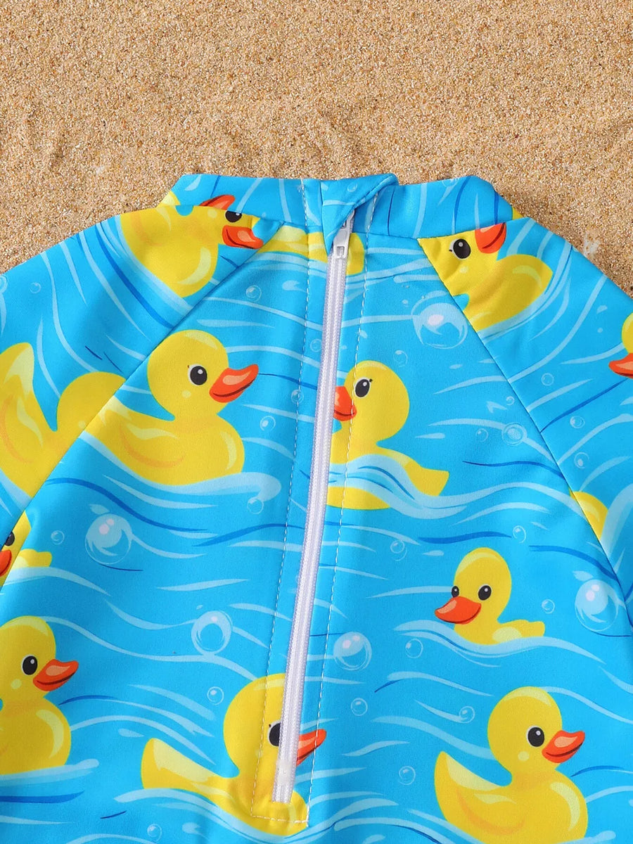 Baby blue one-piece swimsuit with yellow duck print and white zipper.