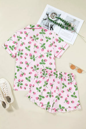 Pink striped pajama set with a strawberry print, featuring a button-up top and ruffled shorts.